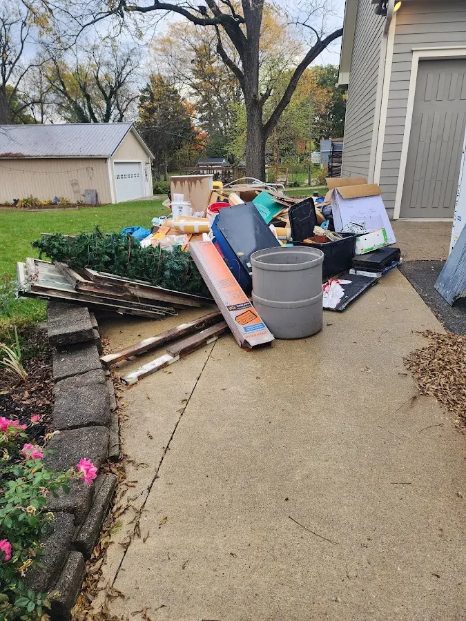 Dumpster being loaded with debris for 3 Yard Dumpster Rental in San Luis